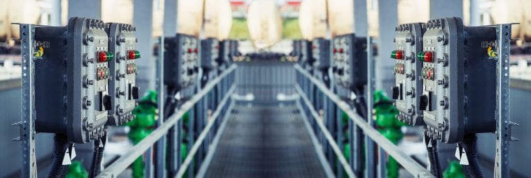 Part of power plant control panel with switches and lamps