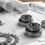 Engineering supplies and blueprints on workplace