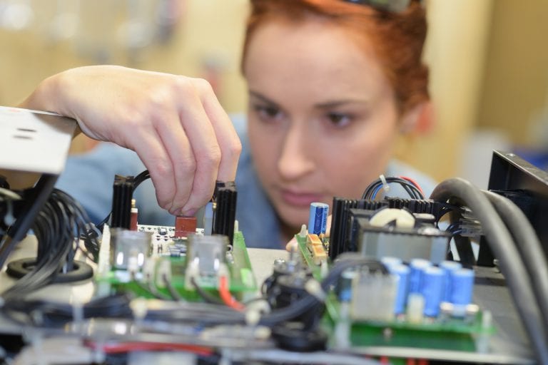 Woman working on electrical system
