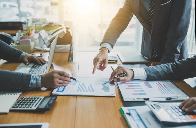 Teamwork process, business people working in the office discussing documents and ideas at meeting