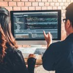 Developing programmer Team Development Website design and coding technologies working in software company office